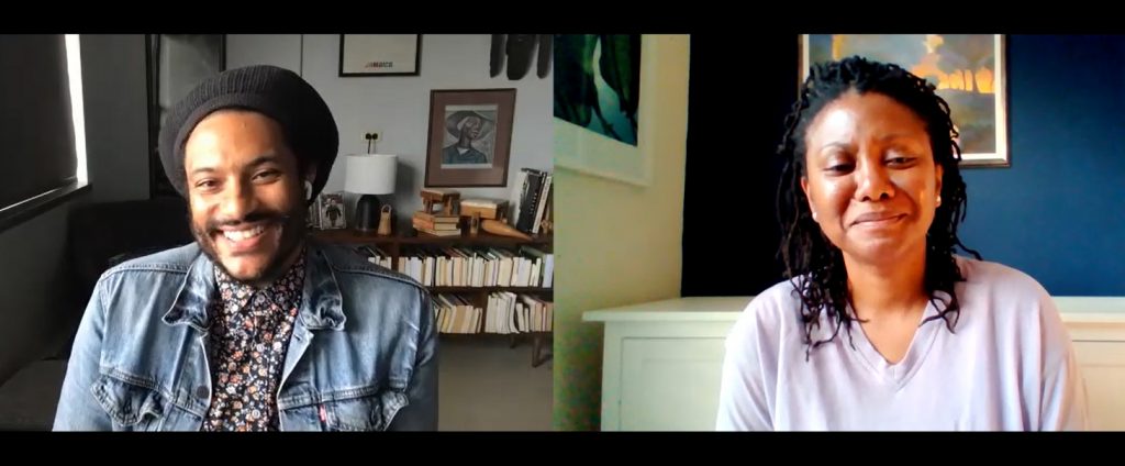 Two Black people enjoying conversation, the side by side views taken from a screen recording. On the left is a Black man with dreadlocks held in a black headwrap. He is wearing a multi coloured shirt and faded blue demin jacket. In the background is a short bookshelf and lots of art on the walls. On the right is a Black women with shorter dreadlock braids, eyes closed in laughter. She is wearing a light grey top. The wall behind her is dark blue and there is a painting directly behind her head.